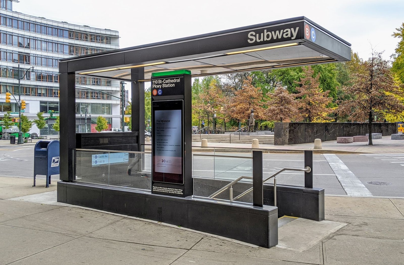 NYC Subway station entrance in Manhattan with first-time riders learning to use OMNY payment system